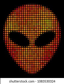 Dot alien face icon. Bright pictogram in orange color tints on a black background. Vector halftone composition of alien face symbol constructed from spheric elements.