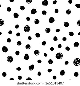Dot doodles seamless pattern. Hand drawn circles texture background.