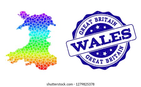 Dot rainbow map of Wales and blue grunge round stamp seal. Vector geographic map in bright rainbow gradient colors on a white background. Colored vector collage of map of Wales created of round items.