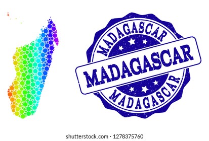 Dot spectrum map of Madagascar Island and blue grunge round stamp seal. Vector geographic map in bright spectrum gradient colors on a white background.