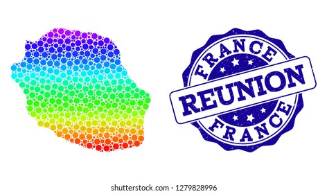 Dot spectrum map of Reunion Island and blue grunge round stamp seal. Vector geographic map in bright spectrum gradient colors on a white background.