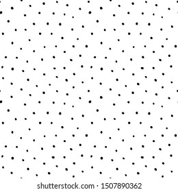 Dots pattern. Seamless texture background. Trendy irregular design. Painted brush strokes polka dot. Chaotic hand drawn artistic tile. Abstract art fashionable fabric. Vector black and white textile. 