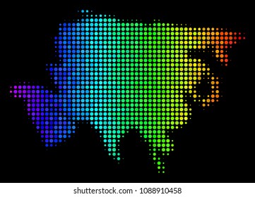 Dotted Asia map. Halftone territorial scheme in spectrum color tinges with horizontal gradient on a black background. Vector composition of Asia map created of circles.