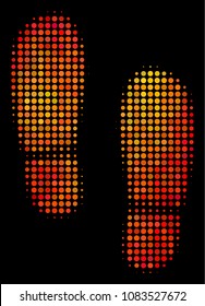 Dotted boot footprints icon. Bright pictogram in fire color tones on a black background. Vector halftone mosaic of boot footprints pictogram combined of round elements.