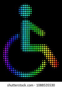 Dotted bright halftone disabled person icon using spectrum color hues with horizontal gradient on a black background.