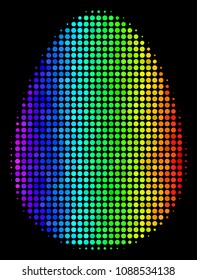 Dotted bright halftone egg icon drawn with rainbow color variations with horizontal gradient on a black background. Color vector mosaic of egg illustration done from circle points.