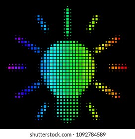 Dotted bright halftone light bulb icon drawn with rainbow color hues with horizontal gradient on a black background.