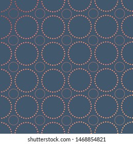 dotted circle fretwork pattern in pale blue and rose gold