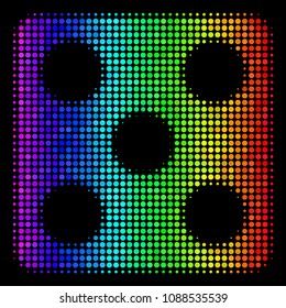 Dotted colorful halftone dice icon in rainbow color tints with horizontal gradient on a black background. Bright vector pattern of dice symbol designed from round cells.