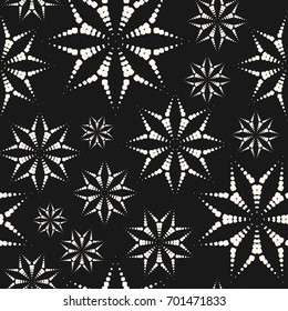 Dotted floral seamless pattern. Vector abstract geometric texture with flower shapes from small circles. Monochrome stippling style background. Elegant dark design for decor, bedding, carpet, cloth