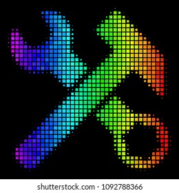 Dotted impressive halftone hammer and wrench icon drawn with spectrum color shades with horizontal gradient on a black background.