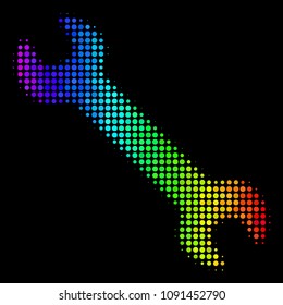 Dotted impressive halftone wrench icon using spectrum color tinges with horizontal gradient on a black background. Colorful vector concept of wrench pictogram combined with spheric points.
