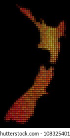 Dotted orange New Zealand map. Vector territorial scheme in fire color tinges on a black background. Halftone mosaic of New Zealand map formed of spheric spots.