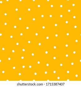 Dotted wallpaper seamless pattern. Abstract yellow background white dots irregular chaotic shapes for textile, fabric, interior decoration. Isolated vector illustration