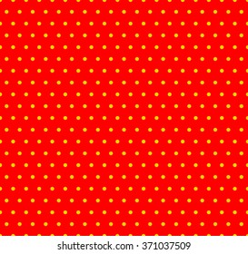 Dotted yellow and red pop art pattern. Seamlessly repeatable background with circles.