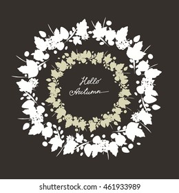 double frame made from leaves, twigs, berries and autumn elements, white silhouette on a dark gray background. Hello Autumn inscription