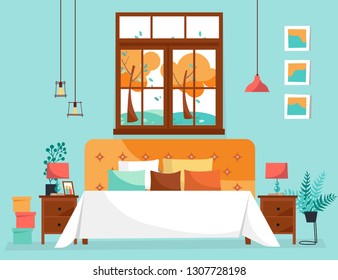 Double large bed with soft back and many pillows under large window with tree landscape. Bedroom interior with bedside tables, potted plants and hanging lamps. Flat cartoon style vector illustration.