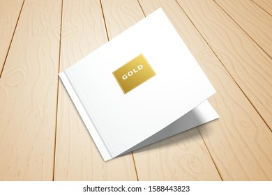 A double postcard with a gold foil lettering frame lies on the plank floor. Realistic template for design