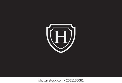 Double shield and golden elegant logo, art, symbol design with alphabet for professional brand and business