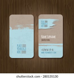 Double-sided grunge business card template with rounded corners on wooden background