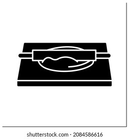 Dough rolling glyph icon. Rolling pin pastry and donuts preparation. Concept of home bread baking and ring doughnuts preparation.Filled flat sign. Isolated silhouette vector illustration