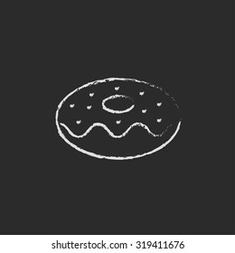 Doughnut hand drawn in chalk on a blackboard vector white icon isolated on a black background.