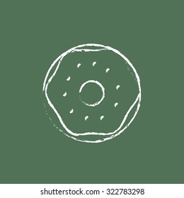 Doughnut hand drawn in chalk on a blackboard vector white icon isolated on a green background.