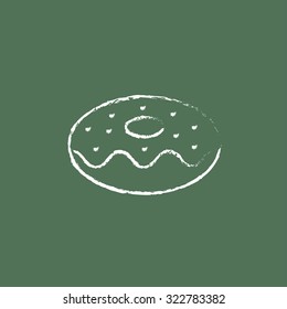 Doughnut hand drawn in chalk on a blackboard vector white icon isolated on a green background.