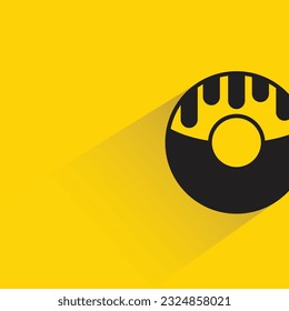 doughnut with shadow on yellow background