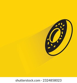 doughnut with shadow on yellow background