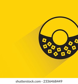 doughnut with shadow on yellow background
