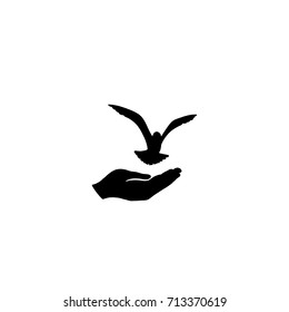 Dove bird free with hand. Bird flying. Peace symbol. Pigeon and hand silhouette. freedom sign.