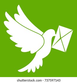 Dove carrying envelope icon white isolated on green background. Vector illustration