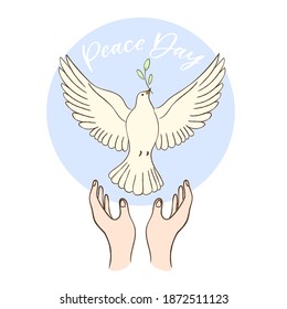Dove of peace released by flying hands on blue background