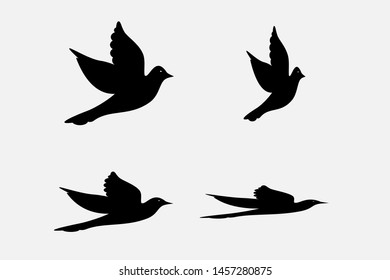 Dove silhouettes , peace symbol. Vector pigeon with spread wings . Holy bird in Christianity, freedom of purity, flight of animal poses isolated