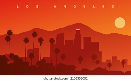 Downtown Los Angeles at sunset. Skyline silhouette with mountains in the background and palms in the foreground, California, USA