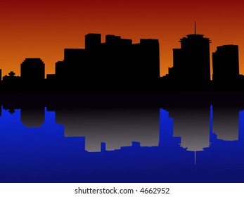 downtown New Orleans skyline reflected in Mississippi River at sunset