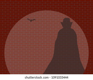 A Dracula And A Bat Shadow In A Spotlight Against A Brick Wall