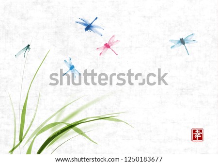 Dragonflies flying over the grass on rice paper background. Traditional oriental ink painting sumi-e, u-sin, go-hua. Hieroglyph - happiness