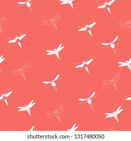 Dragonfly pattern. Origami dragonfly. Insect silhouette. Seamless pattern. Coral background. For cloth, fabric, wrapping paper, home decor.