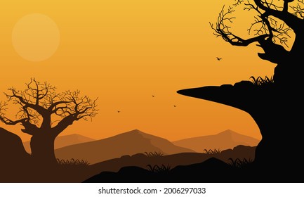 A dramatic view of the mountains with dry tree silhouettes at dusk from the outskirts of the city.  Vector illustration of a city