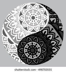 Drawing of a black and white mandala (round ethnic ornament) in shape of symbol yin yang