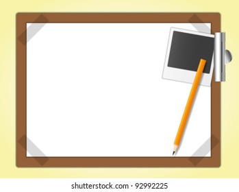 Drawing board and the master photo with pencil.