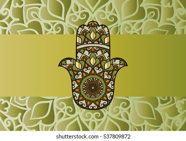 Drawing of card with green hamsa and mandala on the background