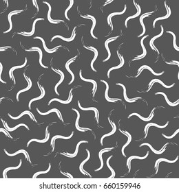 Drawing chaotically scattered wavy smears. Vector seamless pattern.Black and white