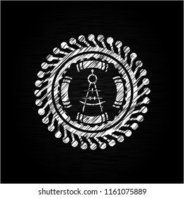 drawing compass icon drawn on a blackboard
