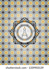 drawing compass icon inside arabesque style badge. arabic decoration.