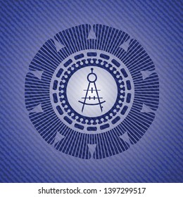 drawing compass icon inside badge with denim texture