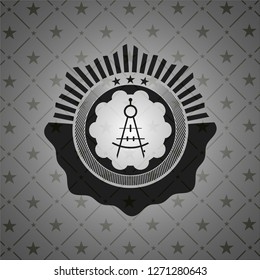 drawing compass icon inside black emblem