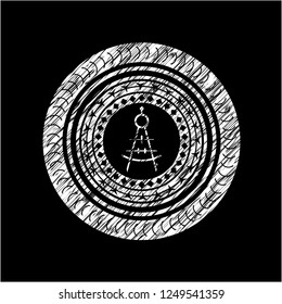 drawing compass icon inside chalkboard emblem on black board